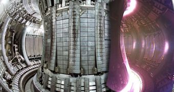 Image inside a typical nuclear fusion reactor; to the right you can see how the reaction area looks like while operational, with the plasma being confined by powerful magnetic fields