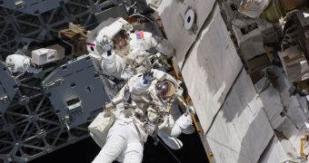 This image shows Discovery astronauts Drew and Bowen during the first EVA of the STS-133 mission
