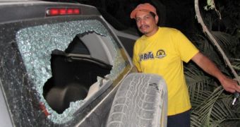 Pap Yuri Cortez shows the damage the over-zealous bodyguard did to his car