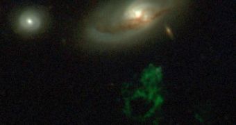 Image showing the Voorwerp (green gas cloud) and the now-dim galaxy IC 2497