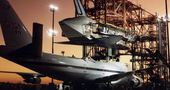 Shuttle Atlantis is seen here being placed atop NASA 911, following the STS-44 mission it conducted in 1991