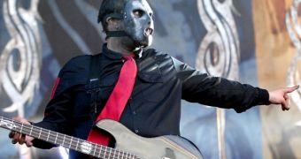 Members of Slipknot remove masks to pay their respects for late bassist Paul Gray