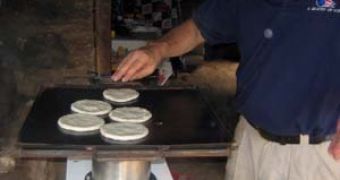 Avi Davis of Project Lighthouse cooking tortillas using an eco-friendly Turbococina