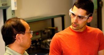 Electrical engineering professor Cun-Zheng Ning (left)and doctoral student Derek Caselli are working on technology that concentrates sunlight onto photovoltaic cells