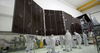 Technicians at Astrotech's payload processing facility in Titusville stow solar array #2 against the body of the NASA Juno spacecraft