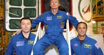 The Soyuz TMA-04M crew poses for an official photo