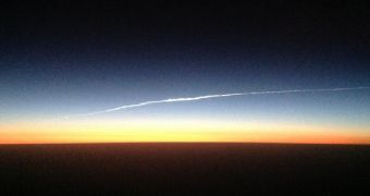 Soyuz TMA-09M is seen here reentering Earth's atmosphere from aboard an intercontinental flight from London to Singapore