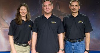 A photo of the Soyuz TMA-18 crew, featuring Alexander Skvortsov (center), Mikhail Kornienko, and NASA astronaut Tracy Caldwell Dyson