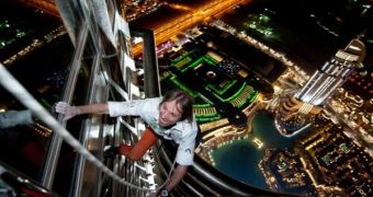 Alain Robert, aka “Spiderman,” climbs the Burj Khalifa in a little over 6 hours