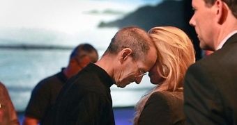 Steve Jobs and wife Laurene Powell Jobs at an Apple keynote presentation
