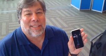 Steve Wozniak holding an iPhone