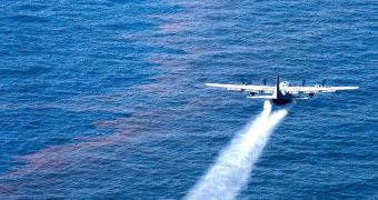 This image shows a C-130 aircraft spreading dispersant chemicals over the Gulf of Mexico oil spill