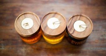 Eco-friendly honey jars are topped with a wooden lid