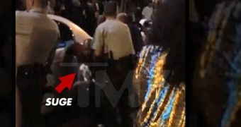 Here Suge Knight can be seen being assisted by police officers to the ambulance after being shot