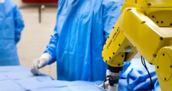 Using gestures to give commands to robots and computers will aid surgeons perform shorter, safer operations on their patients