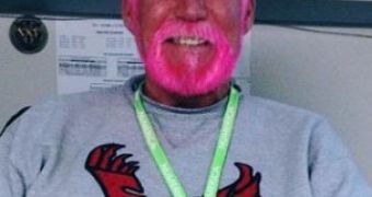 Teacher David Robinson dyes hair, beard pink after losing bet