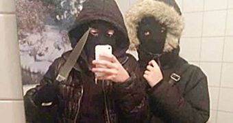 The two teenagers thought is was a good idea to take a selfie with their robbers costumes