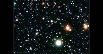 Members of the developing COSMOS-AzTEC3 cluster are circled in white in this image