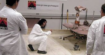 JPL experts Alfonso Herrera, Vandana Verma, and Bruce Banerdt (from left) assess the progress the Spirit replica made in its sandy enclosure