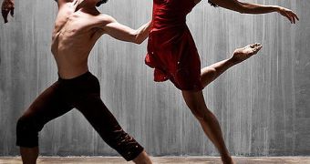 A man and a woman performing a modern dance; dancing can generate almost 250 watts of power