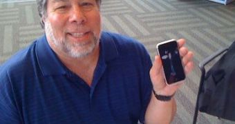 Rather old photo of Wozniak holding a 1st-generation iPhone