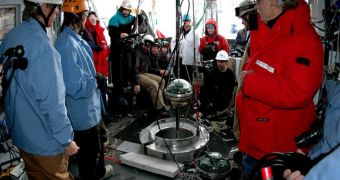 A small group gathers for the deployment of the 86th and final string holding digital optical modules, as the construction of the world's largest neutrino detector came to a close on December 18, 2010