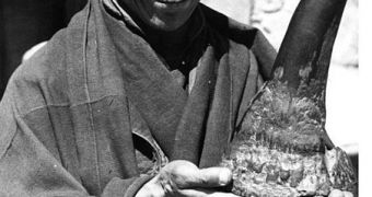 Monk with rhinoceros horn. Samye, Tibet, 1938.