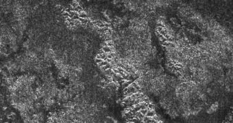 A photo of Titan's surface, showing lake-like structures, most likely filled with liquid hydrocarbons