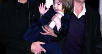 Katie and Tom Cruise, together with Suri, on one of the many family outings