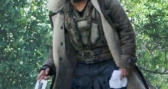 Tom Hardy in costume as Bane on the set of “The Dark Knight Rises”