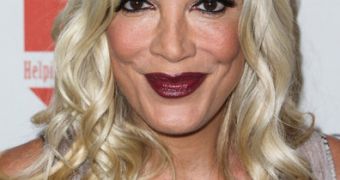 Tori Spelling was hospitalized for stress and anxiety following criticism of “plastic” Katie Holmes comment