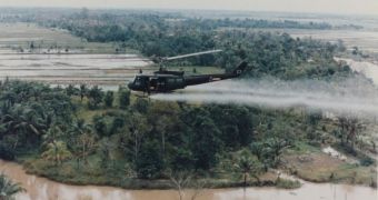 U.S. Huey helicopter spraying harmful Agent Orange over Vietnam as a part of the herbicidal warfare program supported by America