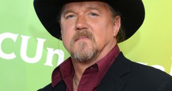 Country singer Trace Adkins has checked into rehab after getting into a fight with an impersonator