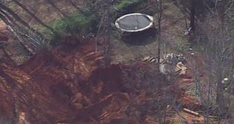 Rescue crews pull out the lifeless bodies of two children from a construction site in North Carolina