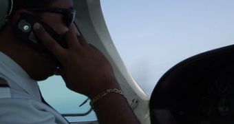 Pilot taking a call during a flight