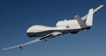 The MQ-4C Triton unmanned aircraft system flies over Edwards Air Force Base, Calif., during a flight test activity in June 2013