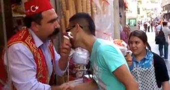 Just before handing out the ice cream the vendor gives the patient customer a kiss on the cheek