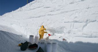 Researchers harvesting snow for analysis, at an Antarctica site