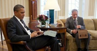 US President, Barack Obama using his iPad