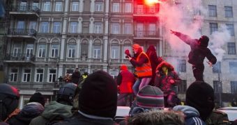 Protesters use flares and Molotov cocktails against riot police