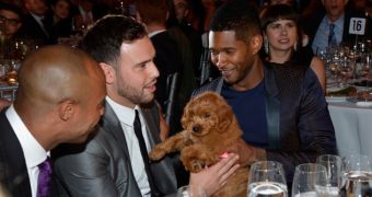 Usher pays $12,000 for a puppy auctioned off at a charity event in New York