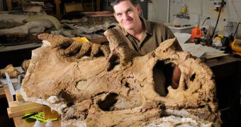 Scott Sampson pictured with the fossil of the species Kosmoceratops richardsoni