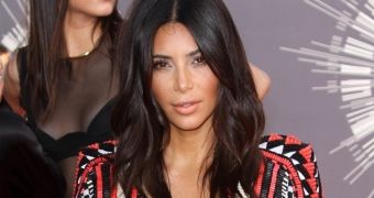 Kim Kardashian does the VMAs 2014 in very low-cut Balmain dress