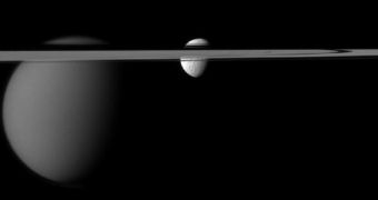 This view of the Saturnine moons Tethys and Titan was collected on December 7, 2011