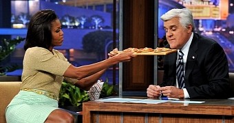 First Lady of the US Michelle Obama offers Jay Leno a culinary treat
