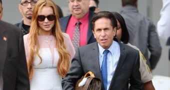 Lindsay Lohan walks into the courthouse with attorney Mark Heller, March 2013