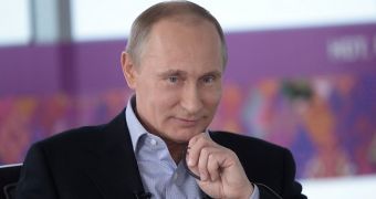 A smiling Vladimir Putin tells western journalists that Russia is not anti-gay