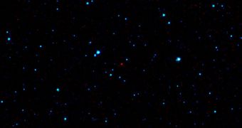 The red dot at the center of this image is the first near-Earth asteroid discovered by WISE