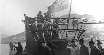Photo shows the German U-boat's crew gathered around the conning tower