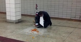 Man eats pasta off subway floor
